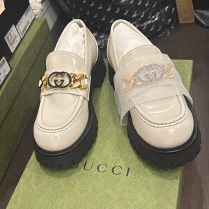 Gucci Cream Leather Lug-Sole Loafers with Gold Chain